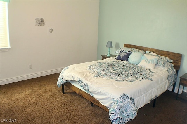 bedroom featuring carpet flooring and baseboards