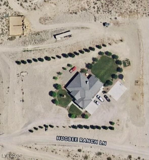 birds eye view of property with a rural view and view of desert