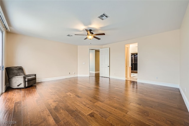 spare room with ceiling fan and hardwood / wood-style flooring