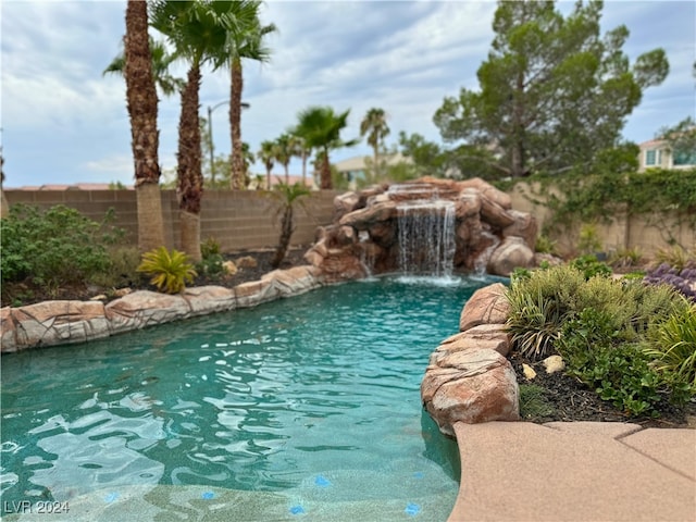 view of pool with pool water feature