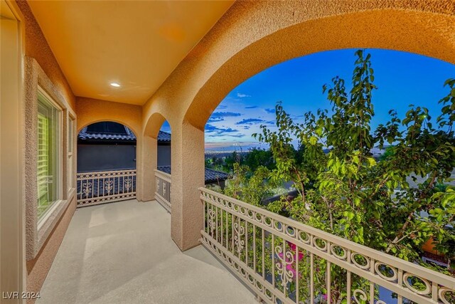 view of balcony at dusk