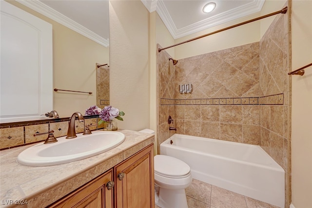 full bathroom featuring tiled shower / bath, tile patterned floors, toilet, vanity, and ornamental molding