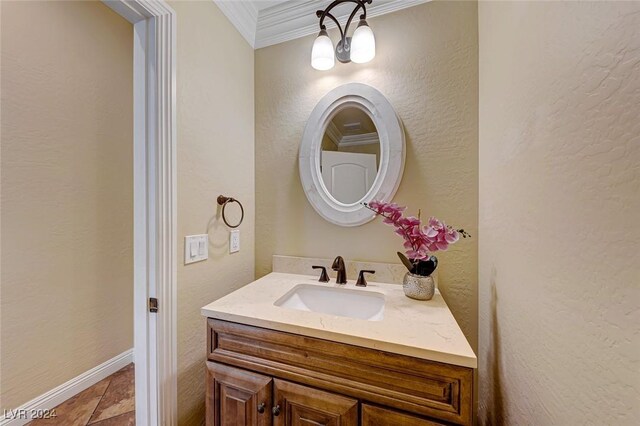 bathroom featuring vanity, crown molding, and tile patterned floors