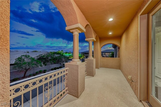 view of balcony at dusk