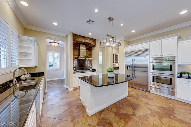 kitchen with stainless steel appliances, light tile patterned floors, a kitchen island, white cabinetry, and range hood