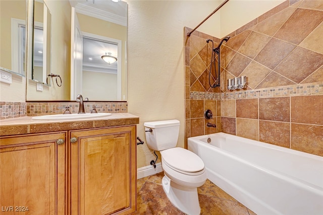 full bathroom featuring tile patterned flooring, tiled shower / bath, toilet, vanity, and ornamental molding