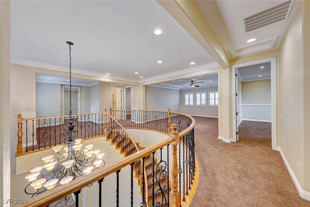 corridor featuring light carpet and crown molding