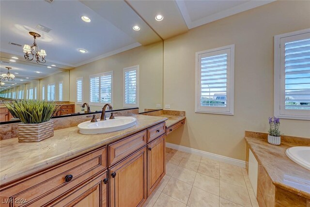 bathroom with tile patterned flooring, crown molding, a tub, vanity, and a notable chandelier