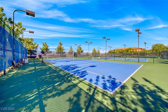 view of tennis court with fence