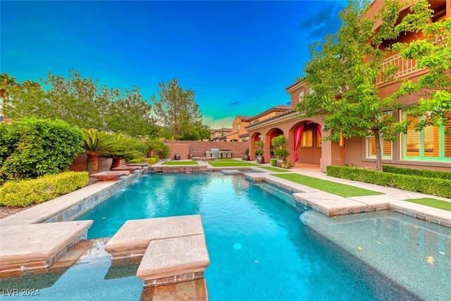 view of pool featuring a patio area and pool water feature