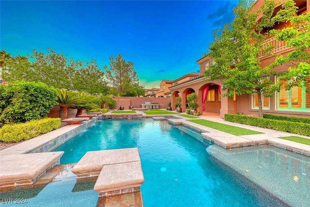 view of pool featuring a fenced in pool and a fenced backyard