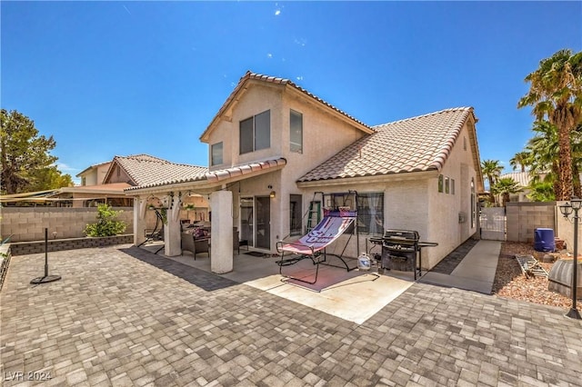 rear view of property with a patio