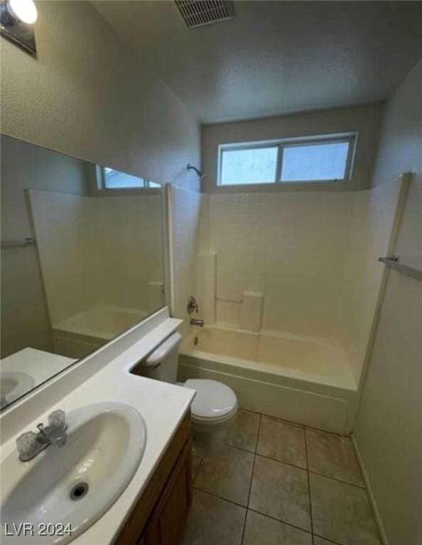 full bathroom with shower / washtub combination, toilet, tile patterned flooring, and vanity