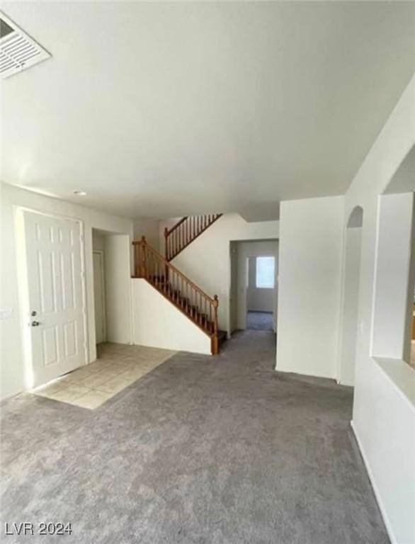 unfurnished living room with carpet floors