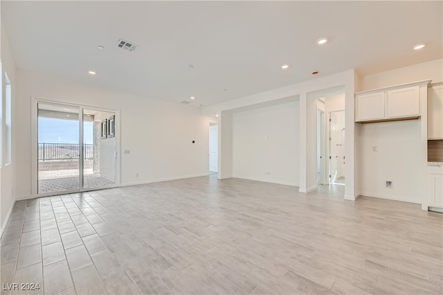 unfurnished living room with light wood-type flooring