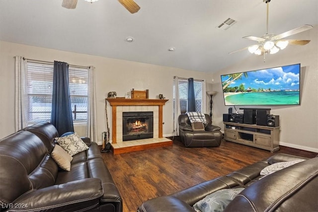 living room featuring ceiling fan, a wealth of natural light, wood finished floors, and visible vents