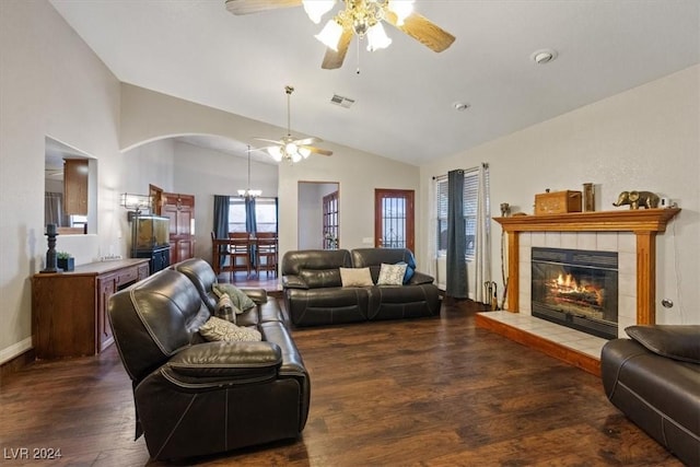 living area featuring ceiling fan, high vaulted ceiling, a fireplace, wood finished floors, and visible vents