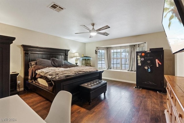 bedroom with a ceiling fan, baseboards, visible vents, and dark wood-style flooring