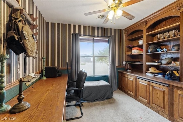 office space with visible vents, ceiling fan, and light carpet