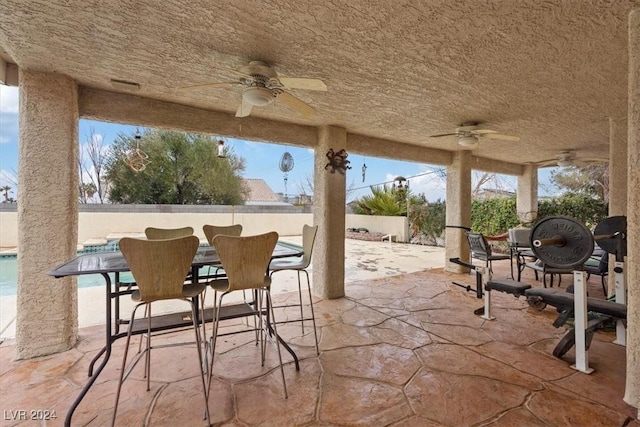 view of patio featuring fence and outdoor dining space