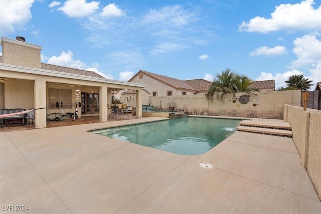 view of swimming pool with a fenced in pool, french doors, a patio area, and a fenced backyard