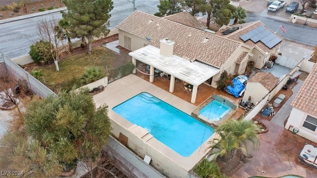 view of swimming pool with a patio area, a fenced backyard, a jacuzzi, and a fenced in pool