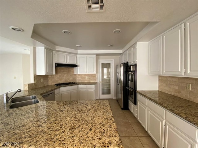 kitchen featuring a sink, visible vents, appliances with stainless steel finishes, and white cabinets