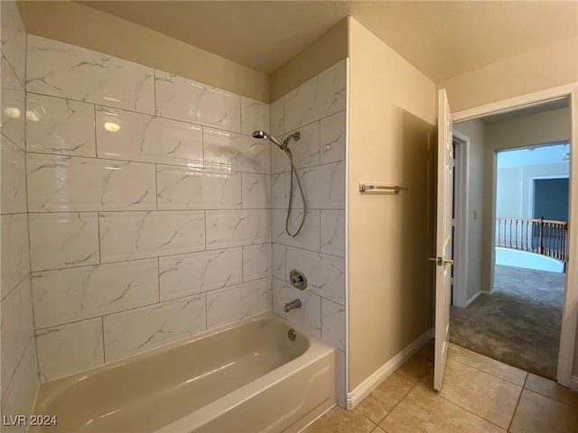 bathroom featuring baseboards, shower / bath combination, and tile patterned floors