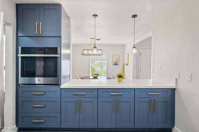 kitchen featuring pendant lighting, oven, a peninsula, and blue cabinetry