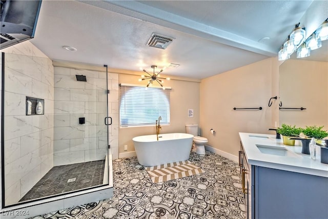 full bathroom with a stall shower, baseboards, visible vents, a freestanding tub, and a sink