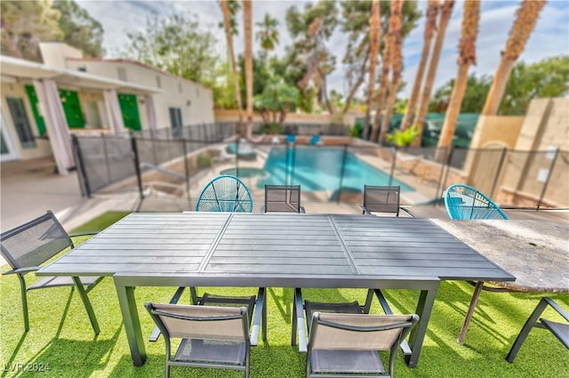 view of pool with a yard and fence