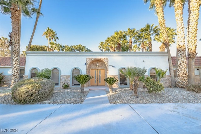 mid-century modern home with stucco siding