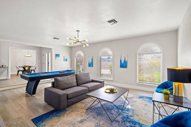 living area with billiards, wood finished floors, visible vents, and baseboards