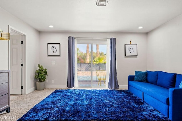 interior space with recessed lighting, visible vents, light carpet, and baseboards