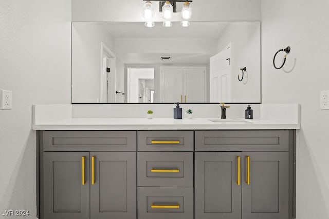 bathroom featuring a sink and double vanity