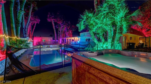 pool at night with fence