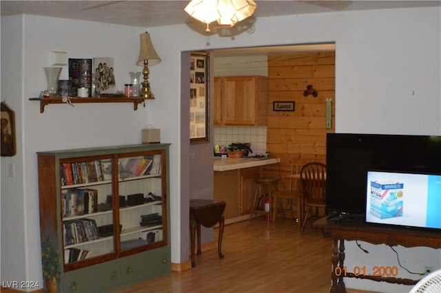 interior space featuring wood-type flooring and ceiling fan