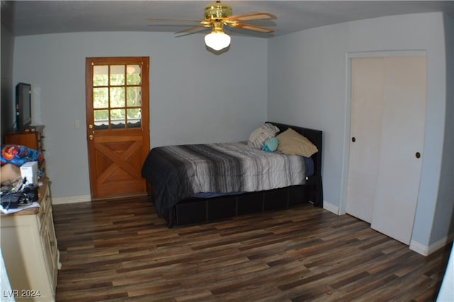 bedroom featuring ceiling fan and dark hardwood / wood-style floors