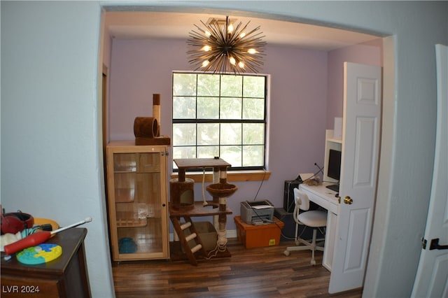 home office with dark hardwood / wood-style floors and a chandelier