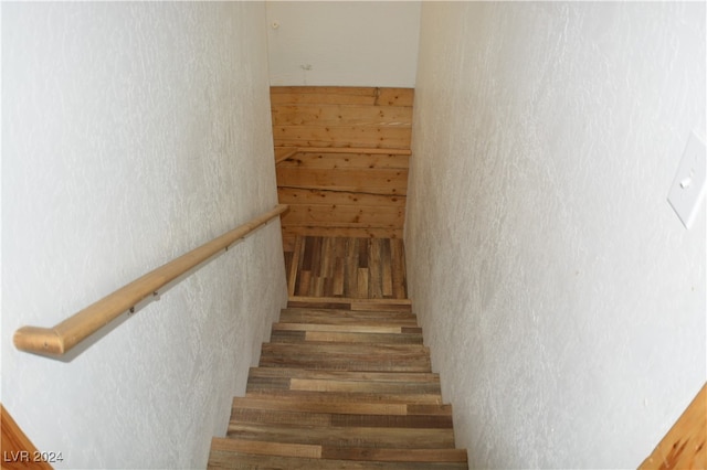 stairs featuring hardwood / wood-style flooring