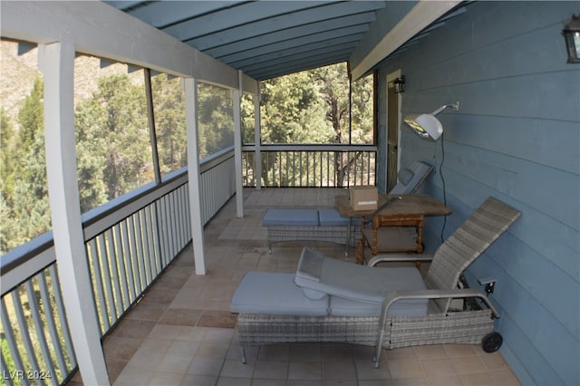 unfurnished sunroom with vaulted ceiling