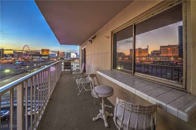 view of balcony at dusk