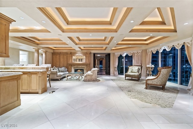 interior space featuring coffered ceiling, beamed ceiling, crown molding, vanity, and decorative columns