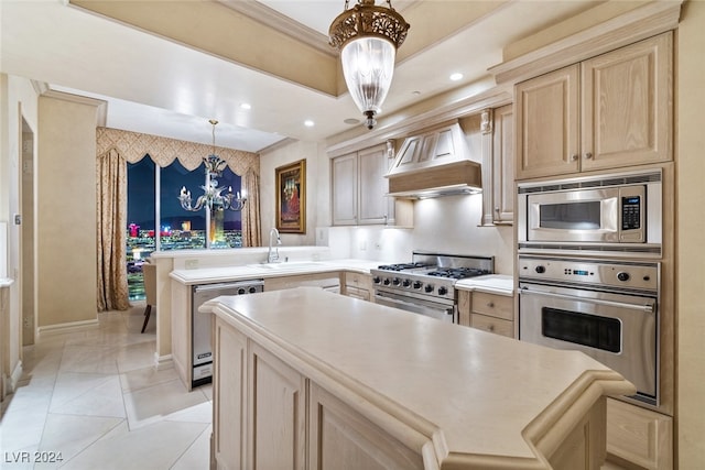 kitchen with light brown cabinetry, an inviting chandelier, custom range hood, appliances with stainless steel finishes, and pendant lighting