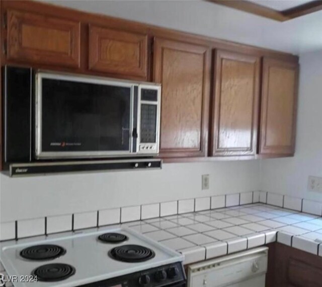 kitchen featuring appliances with stainless steel finishes and tile counters