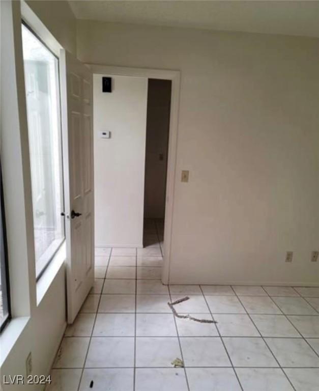 hallway featuring light tile patterned flooring