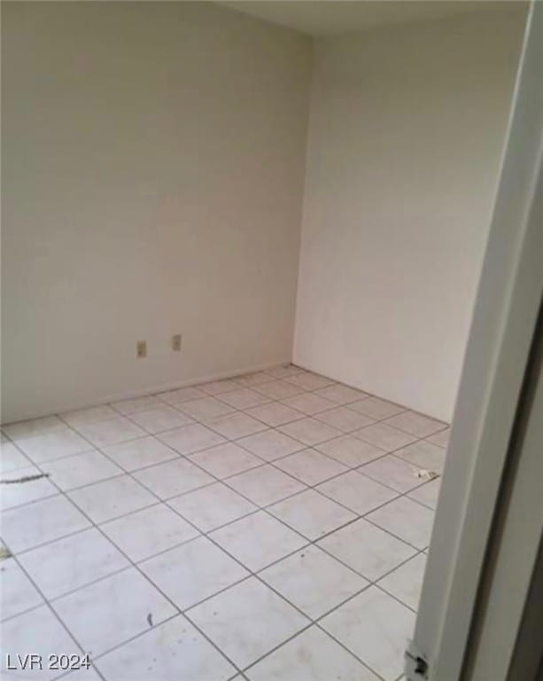 empty room featuring light tile patterned floors