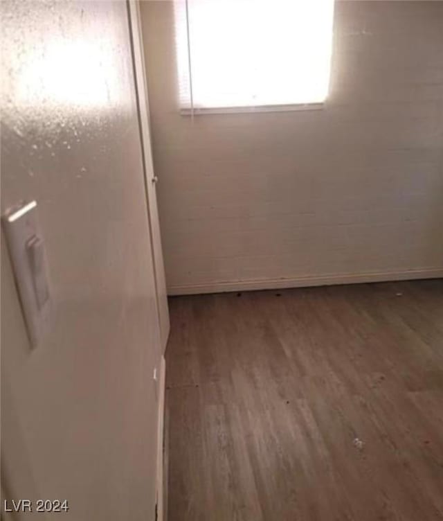 unfurnished room featuring wood-type flooring