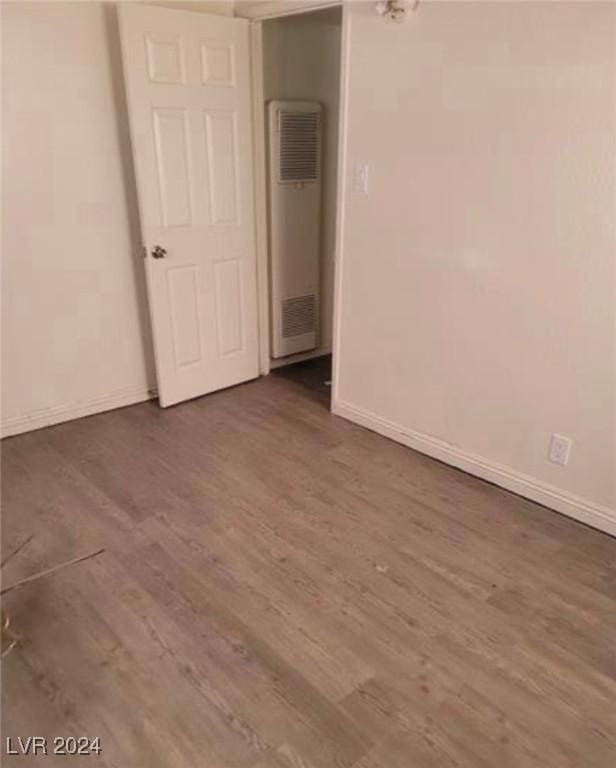 spare room featuring dark hardwood / wood-style floors