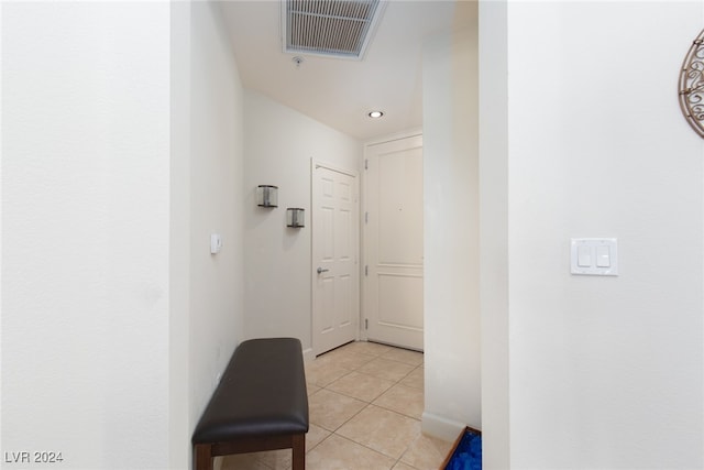 corridor with light tile patterned flooring